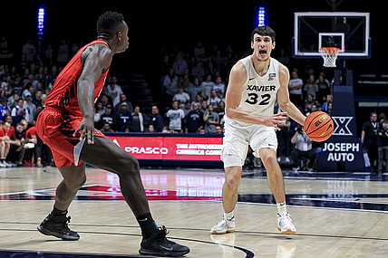 Dec 8, 2021; Cincinnati, Ohio, USA;  Xavier Musketeers forward Zach Freemantle (32) yells to teammates as he controls the ball against the Ball State Cardinals in the second half at the Cintas Center. Mandatory Credit: Aaron Doster-USA TODAY Sports