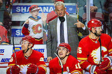 Dec 11, 2021; Calgary, Alberta, CAN; Calgary Flames head coach Darryl Sutter on his bench against the Boston Bruins during the third period at Scotiabank Saddledome. Mandatory Credit: Sergei Belski-USA TODAY Sports