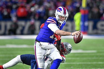 Dec 6, 2021; Orchard Park, New York, USA; Buffalo Bills quarterback Josh Allen (17) and New England Patriots outside linebacker Matt Judon (9) in the third quarter at Highmark Stadium. Mandatory Credit: Mark Konezny-USA TODAY Sports