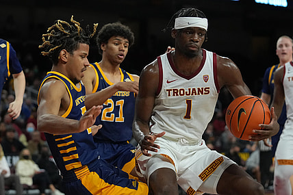 Dec 15, 2021; Los Angeles, California, USA; Southern California Trojans forward Chevez Goodwin (1) is defended by UC Irvine Anteaters guard DJ Davis (22) and guard Langston Redfield (21) in the second half at Galen Center. USC defeated UCI 66-61. Mandatory Credit: Kirby Lee-USA TODAY Sports