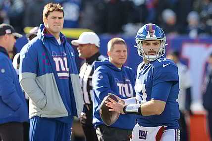 Dec 19, 2021; East Rutherford, New Jersey, USA; New York Giants quarterback Jake Fromm (17) throws the ball as quarterback Daniel Jones (8) looks on before the game against the Dallas Cowboys at MetLife Stadium. Mandatory Credit: Vincent Carchietta-USA TODAY Sports