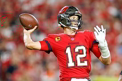 Dec 19, 2021; Tampa, Florida, USA;  Tampa Bay Buccaneers quarterback Tom Brady (12) attempts a pass in the first half against the New Orleans Saints at Raymond James Stadium. Mandatory Credit: Nathan Ray Seebeck-USA TODAY Sports