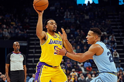 Dec 9, 2021; Memphis, Tennessee, USA; Los Angeles Lakers guard Talen Horton-Tucker (5) passes the ball as Memphis Grizzles guard Desmond Bane (22) defends during the first half at FedExForum. Mandatory Credit: Petre Thomas-USA TODAY Sports