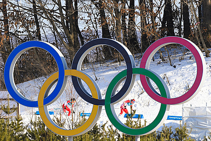 Feb 25, 2018; Pyeongchang, South Korea; Justyna Kowalczyk (POL) and Masako Ishida (JPN) ski past the Olympic rings in the women's 30km classic style cross country event during the Pyeongchang 2018 Olympic Winter Games at Alpensia Cross-Country Centre. Mandatory Credit: Kyle Terada-USA TODAY Sports