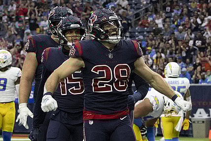 Dec 26, 2021; Houston, Texas, USA; Houston Texans running back Rex Burkhead (28) celebrates after scoring a touchdown against the Los Angeles Chargers in the fourth quarter at NRG Stadium. Mandatory Credit: Thomas Shea-USA TODAY Sports