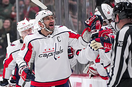 Jan 8, 2022; Saint Paul, Minnesota, USA;  Washington Capitals left wing Alex Ovechkin (8) celebrates after goal by center Evgeny Kuznetsov (92) against the Minnesota Wild in the second period at Xcel Energy Center. Mandatory Credit: Brad Rempel-USA TODAY Sports