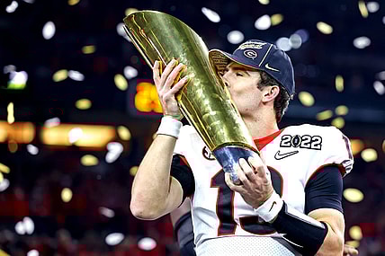 Jan 10, 2022; Indianapolis, IN, USA; Georgia Bulldogs quarterback Stetson Bennett (13) celebrates after the Georgia Bulldogs beat the Alabama Crimson Tide in the 2022 CFP college football national championship game at Lucas Oil Stadium. Mandatory Credit: Mark J. Rebilas-USA TODAY Sports