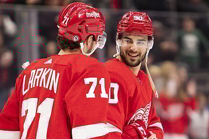 Jan 15, 2022; Detroit, Michigan, USA; Detroit Red Wings center Joe Veleno (90) smiles at center Dylan Larkin (71) after the game against the St. Louis Blues at Little Caesars Arena. Mandatory Credit: Raj Mehta-USA TODAY Sports