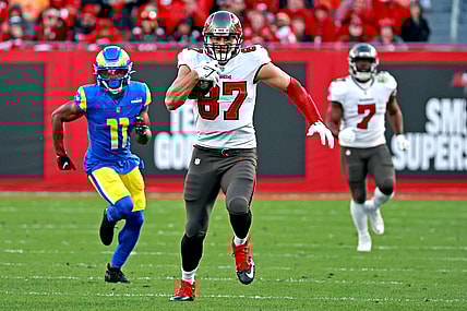 Jan 23, 2022; Tampa, Florida, USA; Tampa Bay Buccaneers tight end Rob Gronkowski (87) runs the ball against Los Angeles Rams cornerback Darious Williams (11) during the second half in a NFC Divisional playoff football game at Raymond James Stadium. Mandatory Credit: Matt Pendleton-USA TODAY Sports