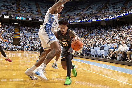Jan 26, 2022; Chapel Hill, North Carolina, USA;  Boston College Eagles guard Brevin Galloway (51) with the ball as North Carolina Tar Heels forward Armando Bacot (5) and guard Leaky Black (1) defend in the first half at Dean E. Smith Center. Mandatory Credit: Bob Donnan-USA TODAY Sports