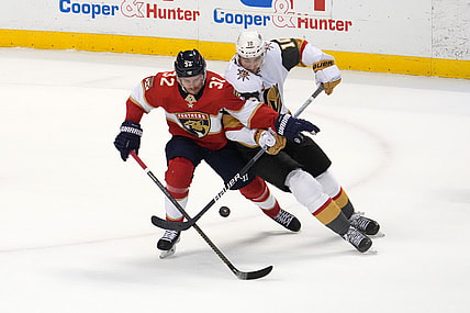 Jan 27, 2022; Sunrise, Florida, USA; Vegas Golden Knights center Nicolas Roy (10) battles Florida Panthers defenseman Lucas Carlsson (32) for the puck during the second period at FLA Live Arena. Mandatory Credit: Jasen Vinlove-USA TODAY Sports