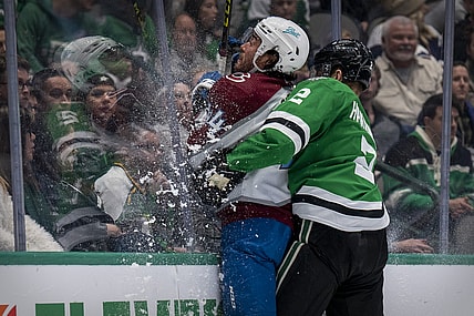 Nov 26, 2021; Dallas, Texas, USA; Dallas Stars defenseman Jani Hakanpaa (2) checks Colorado Avalanche left wing Kiefer Sherwood (44) during the third period at the American Airlines Center. Mandatory Credit: Jerome Miron-USA TODAY Sports