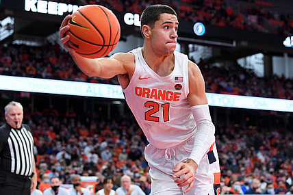 Nov 30, 2021; Syracuse, New York, USA; Syracuse Orange forward Cole Swider (21) saves a loose ball from going out of bounds against the Indiana Hoosiers during the first half at the Carrier Dome. Mandatory Credit: Rich Barnes-USA TODAY Sports
