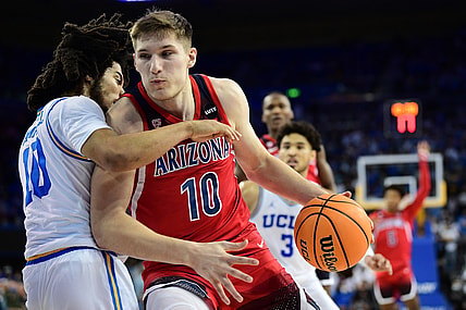 Jan 25, 2022; Los Angeles, California, USA; Arizona Wildcats forward Azuolas Tubelis (10) moves to the basket against UCLA Bruins guard Tyger Campbell (10) during the first half at Pauley Pavilion. Mandatory Credit: Gary A. Vasquez-USA TODAY Sports