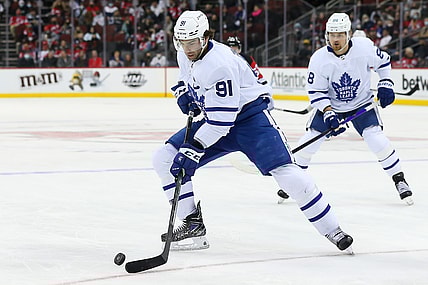 Feb 1, 2022; Newark, New Jersey, USA; Toronto Maple Leafs center John Tavares (91) controls the puck against New Jersey Devils during the first period at Prudential Center. Mandatory Credit: Tom Horak-USA TODAY Sports