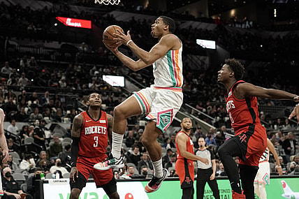 Feb 4, 2022; San Antonio, Texas, USA; San Antonio Spurs forward Keldon Johnson (3) drives to the basket past Houston Rockets forward Jae'Sean Tate (8) during the first half aat AT&T Center. Mandatory Credit: Scott Wachter-USA TODAY Sports