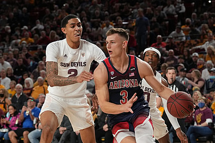 Feb 7, 2022; Tempe, Arizona, USA; Arizona Wildcats guard Pelle Larsson (3) dribbles against Arizona State Sun Devils forward Jalen Graham (2) during the first half at Desert Financial Arena. Mandatory Credit: Joe Camporeale-USA TODAY Sports