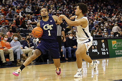 Feb 12, 2022; Charlottesville, Virginia, USA; Georgia Tech Yellow Jackets guard Kyle Sturdivant (1) drives to the basket as Virginia Cavaliers guard Malachi Poindexter (11) defends during the first half at John Paul Jones Arena. Mandatory Credit: Geoff Burke-USA TODAY Sports