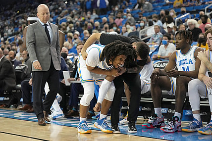 Feb 19, 2022; Los Angeles, California, USA; UCLA Bruins guard Tyger Campbell (10) reacts after suffering an injury against the Washington Huskies in the first half at Pauley Pavilion presented by Wescom. Mandatory Credit: Kirby Lee-USA TODAY Sports