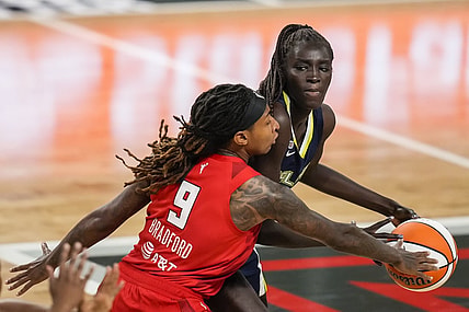 May 27, 2021; College Park, Georgia, USA; Dallas Wings center Awak Kuier (28) has the ball taken away by Atlanta Dream forward Crystal Bradford (9) during the second half at Gateway Center Arena at College Park. Mandatory Credit: Dale Zanine-USA TODAY Sports