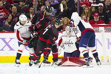 Nov 28, 2021; Raleigh, North Carolina, USA;  Washington Capitals goaltender Ilya Samsonov (30) stops Carolina Hurricanes right wing Jesper Fast (71) and center Jordan Staal (11) during the third period at PNC Arena. Mandatory Credit: James Guillory-USA TODAY Sports