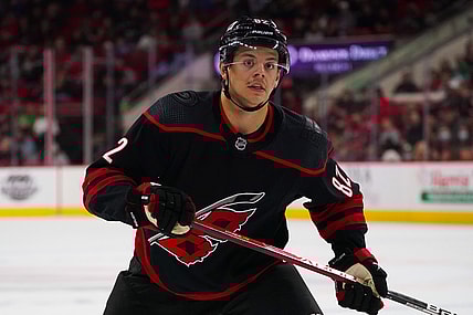 Feb 25, 2022; Raleigh, North Carolina, USA;  Carolina Hurricanes center Jesperi Kotkaniemi (82) watches the play against the Columbus Blue Jackets during the third period at PNC Arena. Mandatory Credit: James Guillory-USA TODAY Sports
