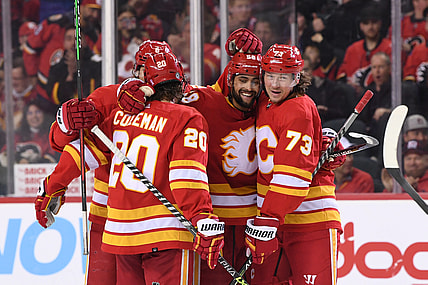 Mar 8, 2022; Calgary, Alberta, CAN; Calgary Flames defenseman Oliver Kylington (58) celebrates his third period goal against the Washington Capitals at Scotiabank Saddledome. Mandatory Credit: Candice Ward-USA TODAY Sports