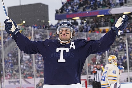 Mar 13, 2022; Hamilton, Ontario, CAN; Toronto Maple Leafs forward Auston Matthews (34) celebrats his goal against Buffalo Sabres goaltender Craig Anderson (41) during the second period in the 2022 Heritage Classic ice hockey game at Tim Hortons Field. Mandatory Credit: John E. Sokolowski-USA TODAY Sports