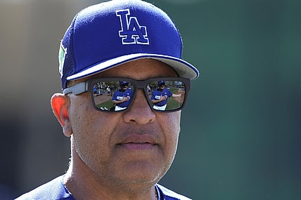 Mar 15, 2022; Glendale, AZ, USA; Los Angeles Dodgers manager Dave Roberts (30) watches warmups during spring training camp at Camelback Ranch. Mandatory Credit: Rick Scuteri-USA TODAY Sports