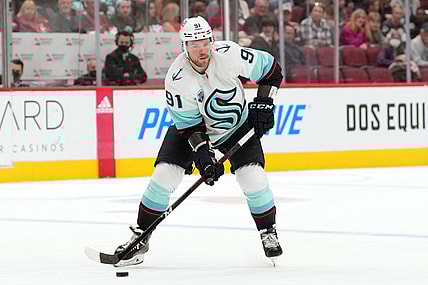 Mar 22, 2022; Glendale, Arizona, USA; Seattle Kraken right wing Daniel Sprong (91) skates with the puck against the Arizona Coyotes during the second period at Gila River Arena. Mandatory Credit: Joe Camporeale-USA TODAY Sports