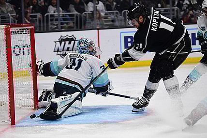 Mar 26, 2022; Los Angeles, California, USA; Los Angeles Kings center Anze Kopitar (11) scores a goal against Seattle Kraken goaltender Philipp Grubauer (31) during the second period at Crypto.com Arena. Mandatory Credit: Gary A. Vasquez-USA TODAY Sports