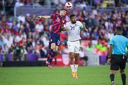 Mar 27, 2022; Orlando, Florida, USA; United States forward Christian Pulisic (10) battles for the ball against Panama midfielder Anibal Godoy (20) in the first half during a FIFA World Cup Qualifier soccer match at Exploria Stadium. Mandatory Credit: Jeremy Reper-USA TODAY Sports