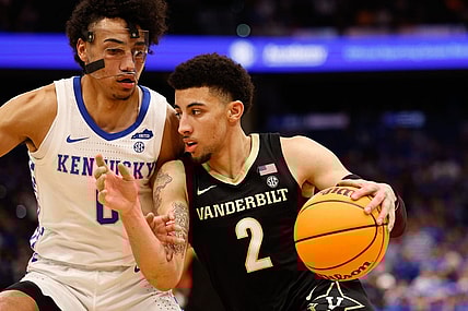 Mar 11, 2022; Tampa, FL, USA; Vanderbilt Commodores guard Scotty Pippen Jr. (2) drives to the basket while guarded by Kentucky Wildcats forward Jacob Toppin (0) in the second half at Amelie Arena. Mandatory Credit: Nathan Ray Seebeck-USA TODAY Sports