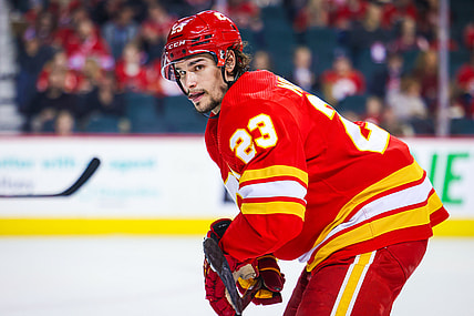 Mar 12, 2022; Calgary, Alberta, CAN; Calgary Flames center Sean Monahan (23) during the face off against the Detroit Red Wings during the second period at Scotiabank Saddledome. Mandatory Credit: Sergei Belski-USA TODAY Sports