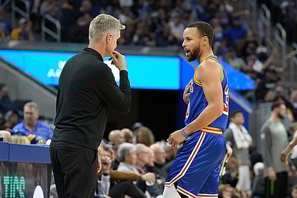 Mar 12, 2022; San Francisco, California, USA; Golden State Warriors guard Stephen Curry (30) talks to head coach Steve Kerr during the third quarter against the Milwaukee Bucks at Chase Center. Mandatory Credit: Darren Yamashita-USA TODAY Sports