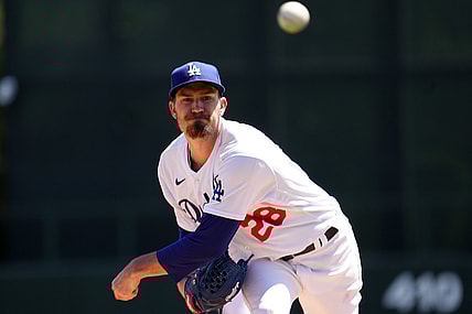 Mar 27, 2022; Phoenix, Arizona, USA; Los Angeles Dodgers starting pitcher Andrew Heaney (28) pitches against the Chicago White Sox during the first inning of a spring training game at Camelback Ranch-Glendale. Mandatory Credit: Joe Camporeale-USA TODAY Sports
