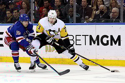 Apr 7, 2022; New York, New York, USA; Pittsburgh Penguins center Evgeni Malkin (71) controls the puck against New York Rangers center Ryan Strome (16) during the second period at Madison Square Garden. Mandatory Credit: Brad Penner-USA TODAY Sports