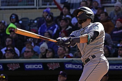 Apr 8, 2022; Minneapolis, Minnesota, USA;  Seattle Mariners right fielder Mitch Haniger (17) hits a two-run home run off of Minnesota Twins starting pitcher Joe Ryan (41) during the first inning at Target Field. Mandatory Credit: Nick Wosika-USA TODAY Sports