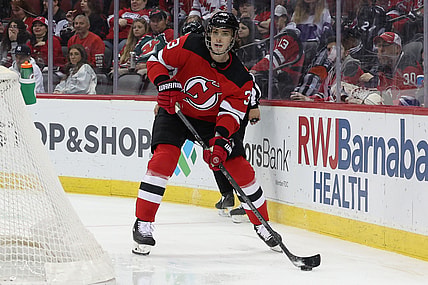 Apr 23, 2022; Newark, New Jersey, USA; New Jersey Devils defenseman Ryan Graves (33) controls the puck against the Carolina Hurricanes during the first period at Prudential Center. Mandatory Credit: Vincent Carchietta-USA TODAY Sports