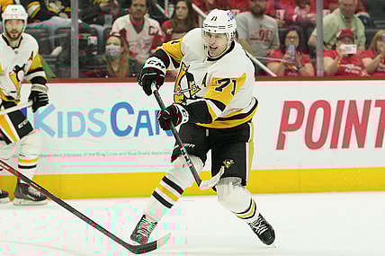 Apr 23, 2022; Detroit, Michigan, USA; Pittsburgh Penguins center Evgeni Malkin (71) takes a shot during the third period against the Detroit Red Wings at Little Caesars Arena. Mandatory Credit: Raj Mehta-USA TODAY Sports