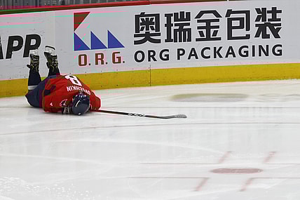 Apr 24, 2022; Washington, District of Columbia, USA; Washington Capitals left wing Alex Ovechkin (8) lies on the ice after being injured while crashing into the boards after being tripped on a breakaway attempt against the Toronto Maple Leafs in the third period at Capital One Arena. Mandatory Credit: Geoff Burke-USA TODAY Sports