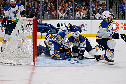 Apr 26, 2022; Denver, Colorado, USA; St. Louis Blues goaltender Jordan Binnington (50) dives for the puck as it hits the back of the net as center Ryan O'Reilly (90) and defenseman Marco Scandella (6) defend as Colorado Avalanche center Alex Newhook (18) lies on the ice in the second period at Ball Arena. Mandatory Credit: Isaiah J. Downing-USA TODAY Sports