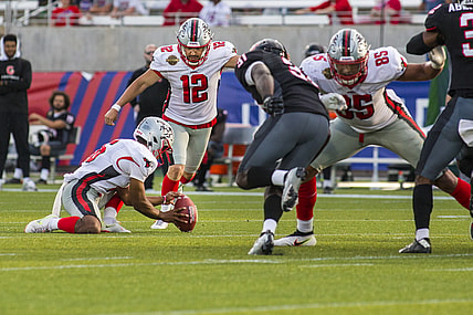 Apr 30, 2022; Birmingham, AL, USA; Tampa Bay Bandits kicker Tyler Rausa (12) kicks the game winning field goal against the Houston Gamblers with 14 seconds left in the second half at Protective Stadium. Mandatory Credit: Vasha Hunt-USA TODAY Sports