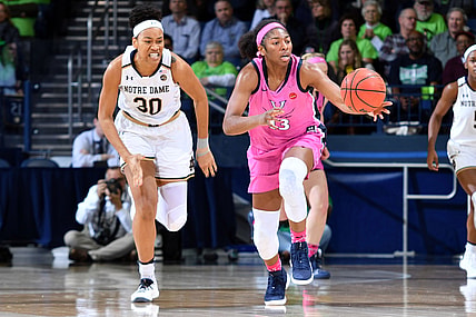 Mar 3, 2019; South Bend, IN, USA; Virginia Cavaliers guard Jocelyn Willoughby (13) grabs a loose ball as Notre Dame Fighting Irish center Mikayla Vaughn (30) pursues in the first half at the Purcell Pavilion. Mandatory Credit: Matt Cashore-USA TODAY Sports