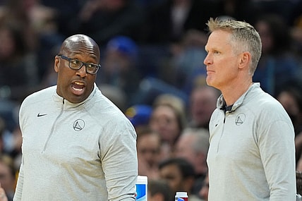Mar 8, 2022; San Francisco, California, USA; Golden State Warriors assistant coach Mike Brown talks to head coach Steve Kerr during the third quarter against the LA Clippers at Chase Center. Mandatory Credit: Darren Yamashita-USA TODAY Sports
