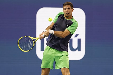 Mar 24, 2022; Miami Gardens, FL, USA; Federico Delbonis (ARG) hits a backhand against Andy Murray (GBR) (not pictured) in a first round men's singles match in the Miami Open at Hard Rock Stadium. Mandatory Credit: Geoff Burke-USA TODAY Sports