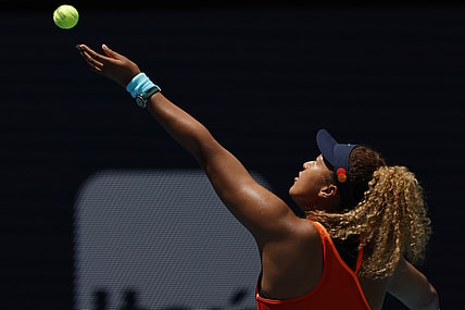 Apr 2, 2022; Miami Gardens, FL, USA; Naomi Osaka (JPN) hits a backhand against Iga Swiatek (POL)(not pictured) in the women's singles final in the Miami Open at Hard Rock Stadium. Mandatory Credit: Geoff Burke-USA TODAY Sports