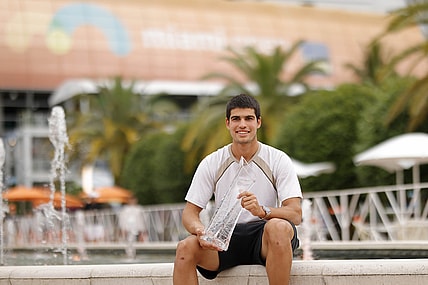Apr 3, 2022; Miami Gardens, FL, USA; Carlos Alcaraz (ESP) poses for a portrait while holding the Butch Buchholz Championship Trophy after winning the men's singles final in the Miami Open at Hard Rock Stadium. Mandatory Credit: Geoff Burke-USA TODAY Sports