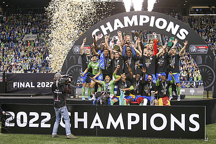 May 4, 2022; Seattle, WA, USA; Seattle Sounders FC players, including midfielder Nicolas Lodeiro (10, holding trophy) celebrate after defeating Pumas 3-0 in the second leg of the Concacaf Champions League Final at Lumen Field. Mandatory Credit: Joe Nicholson-USA TODAY Sports