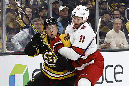 May 6, 2022; Boston, Massachusetts, USA; Carolina Hurricanes center Jordan Staal (11) collides with Boston Bruins defenseman Charlie McAvoy (73) during the first period in game three of the first round of the 2022 Stanley Cup Playoffs at TD Garden. Mandatory Credit: Winslow Townson-USA TODAY Sports